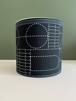 Black high drum lampshade for bedroom and living room. Lighting accessory for the home. Available in size 24cm(w)x27cm(h), pattern detail.