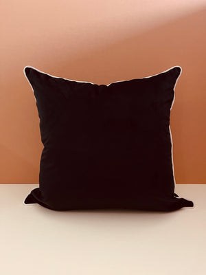 60cm x 60cm plain black scatter cushion with beige piping detail for bedroom, bold shapes, plain matching background 