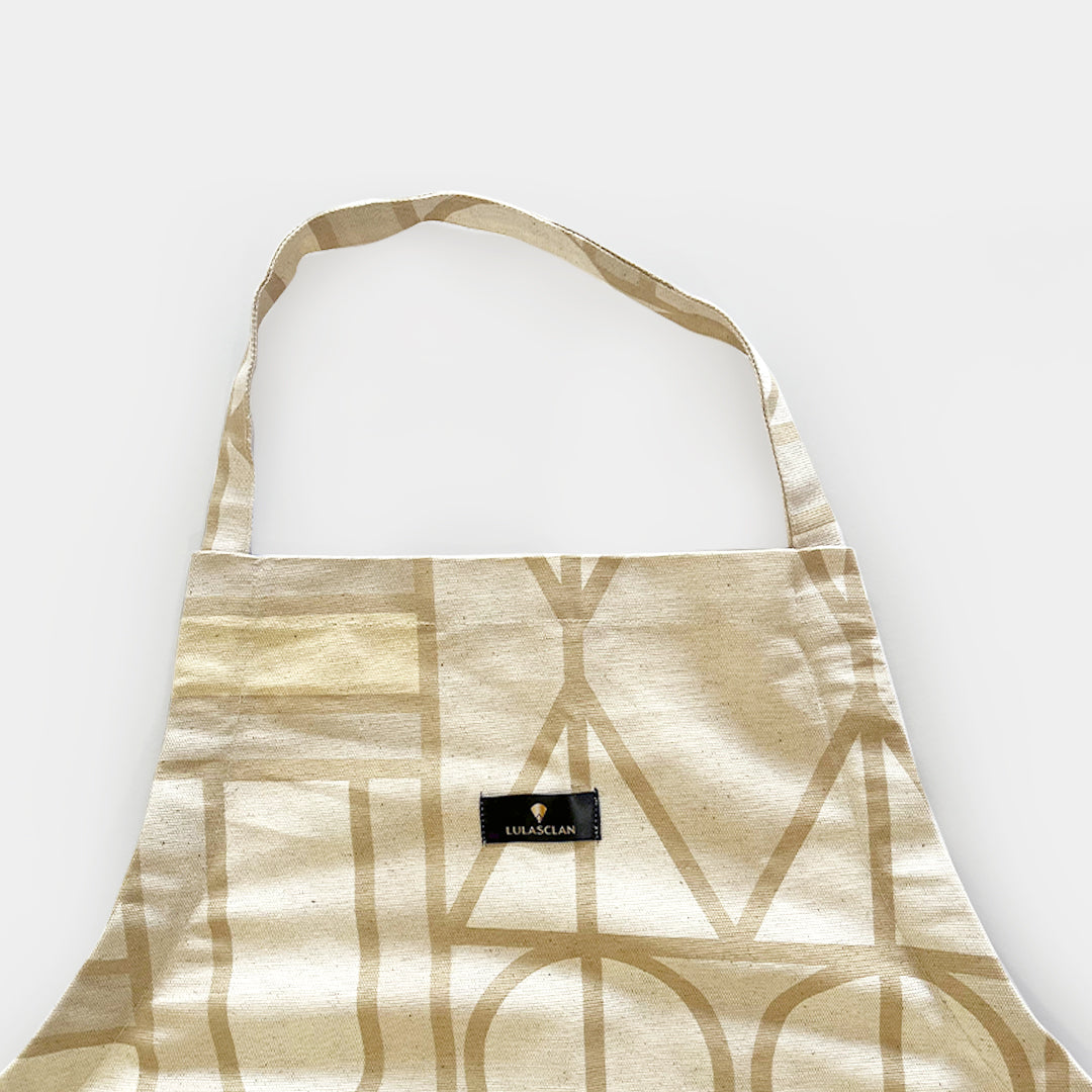 Legae Peace neutral coloured apron, with adjustable straps made in Cape Town South Africa.