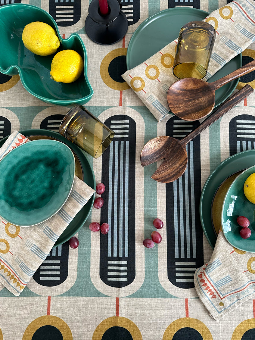 A Linen patterned table cloth with textile prints and table setting