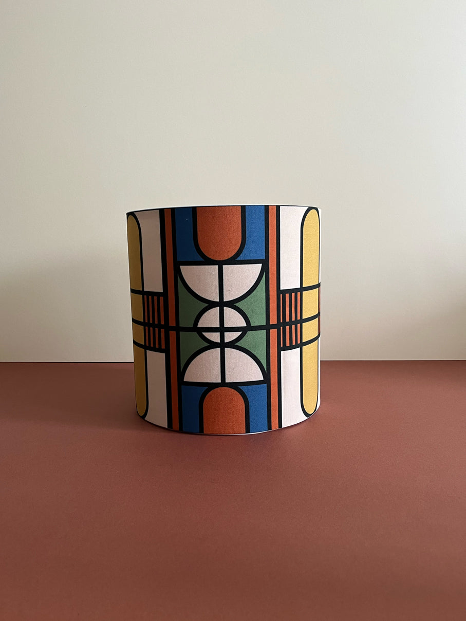 Colourful geometric drum lampshade for bedroom and living room. Lighting accessory for the home. Available in size 24cm(w)x27cm(h)